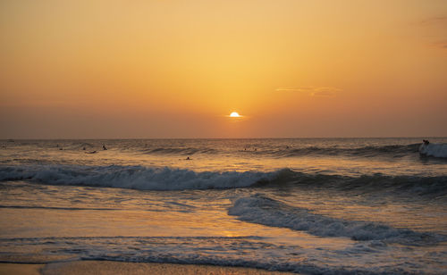 Scenic view of sea against sky during sunset