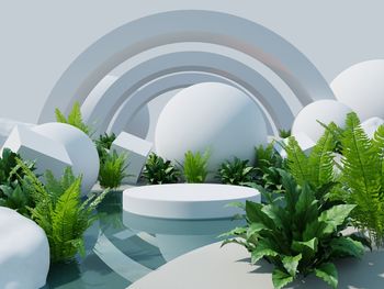 White product display podium in the middle of the water with white desert background.3d rendering