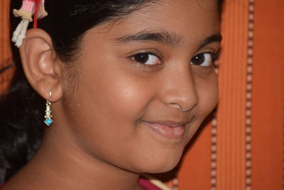 Close-up portrait of smiling girl