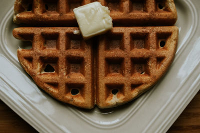 Close up of a waffle with butter