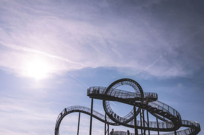 Low angle view of ferris wheel against sky