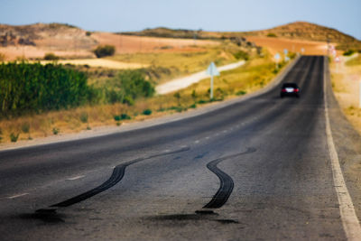 Cars on road against sky