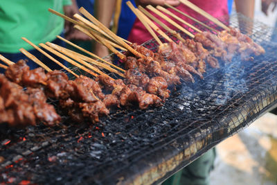 Close-up of meat on barbecue grill