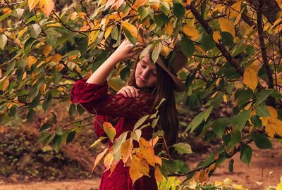 Portrait of woman holding leaves