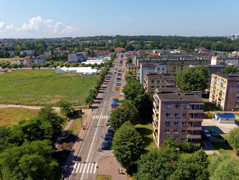 High angle view of trees and buildings against sky