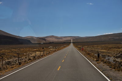 Empty road against sky