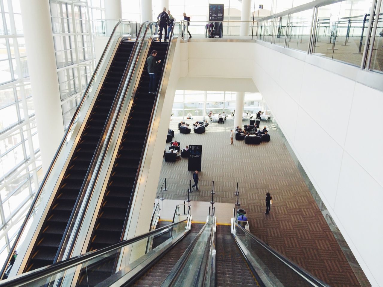 transportation, men, indoors, person, public transportation, architecture, large group of people, the way forward, lifestyles, high angle view, escalator, built structure, walking, rail transportation, railroad track, railroad station, railroad station platform, railing, travel