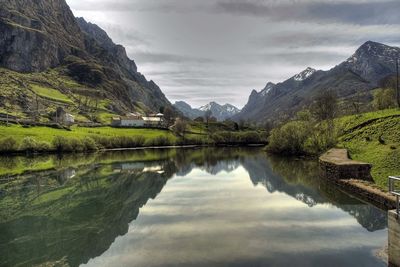 Scenic view of lake and mountains against sky