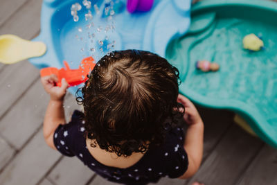 Child playing with water toys