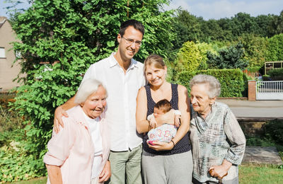 Portrait of family standing outdoors