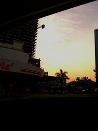 View of city against sky at sunset