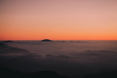 Scenic view of silhouette mountain against sky during sunset