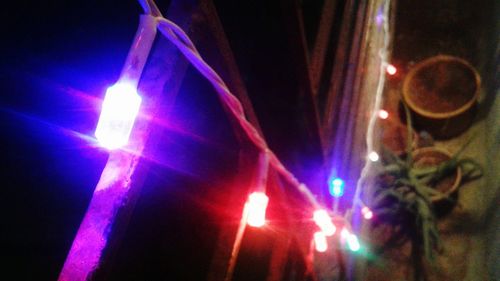 Close-up of illuminated lighting equipment at night