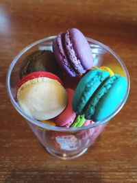 Close-up of macaroons in glass on table