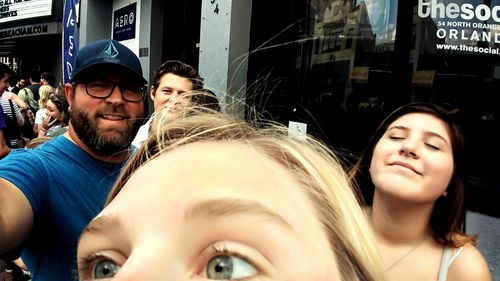 Portrait of smiling young couple standing outdoors