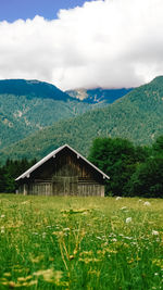 Built structure on landscape against sky