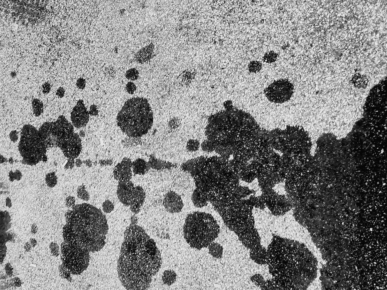 CLOSE-UP OF FOOTPRINTS ON SAND