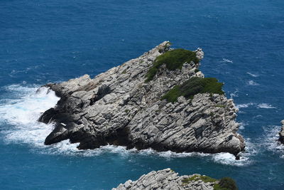 High angle view of rock formation in sea