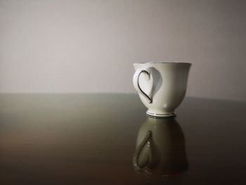 Close-up of coffee cup on table