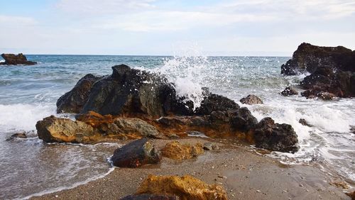 Sea waves splashing on rocks