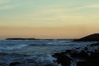 Scenic view of sea at sunset