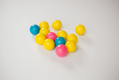 Close-up of colorful balloons against white background