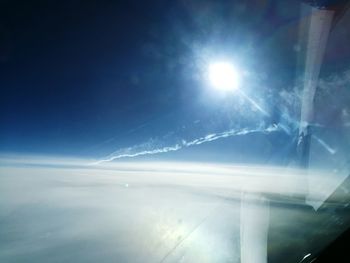 Aerial view of sun shining through sky