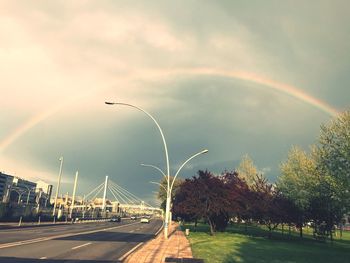 View of rainbow over city street