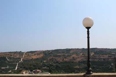 Street light against clear sky