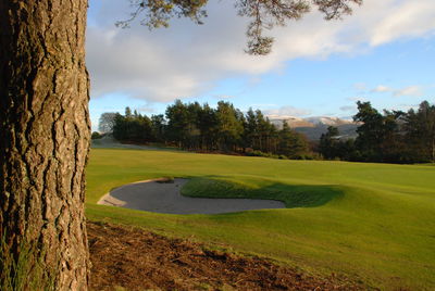 High angle view of golf course against sky