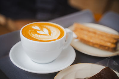 Close-up of cappuccino on table