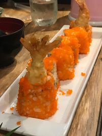 Close-up of sushi served on table