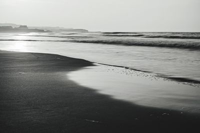 Scenic view of beach against clear sky