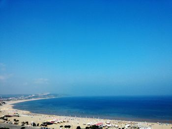 Scenic view of sea against blue sky