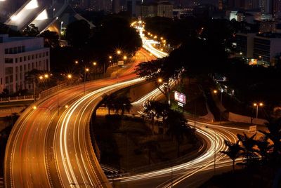 High angle view of light trails on road at night