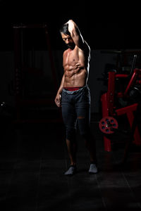 Rear view of woman standing in gym