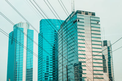 Low angle view of office building against sky