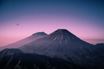 Scenic view of mountain range against sky during sunset