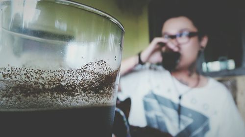 Woman drinking juice at home