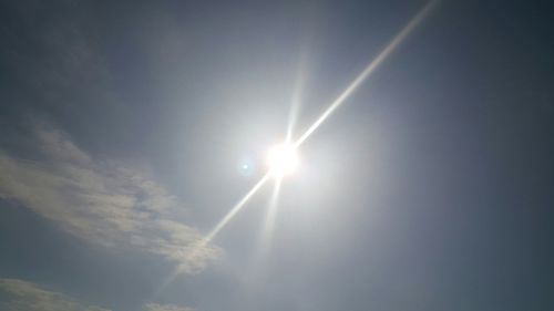 Sun shining through clouds