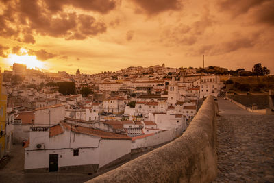 High angle view of townscape against sky during sunset