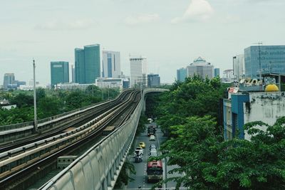 High angle view of railroad tracks amidst buildings in city