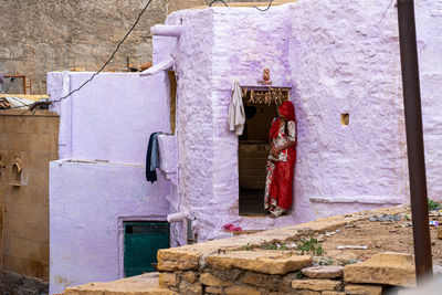 Clothes hanging on wall of building