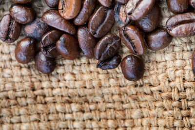 Close-up of roasted coffee beans on table