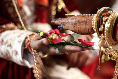 Close-up of hands holding flowers