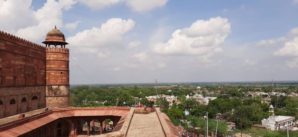 Panoramic shot of buildings in town against sky