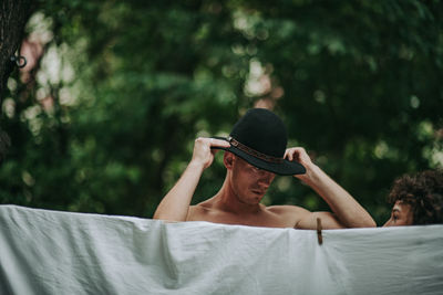 Portrait of a young man wearing hat