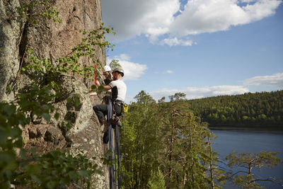 View of rock climbers on rock face