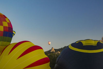 Multi colored hot air balloon flying in sky