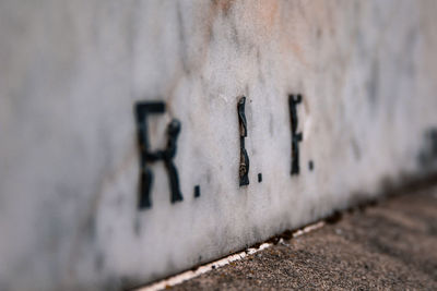Close-up of text on wall